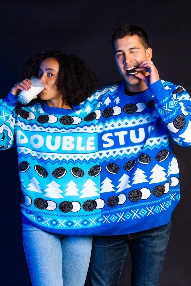 A person winning an ugly Christmas sweater contest wearing a 6XL sweater.