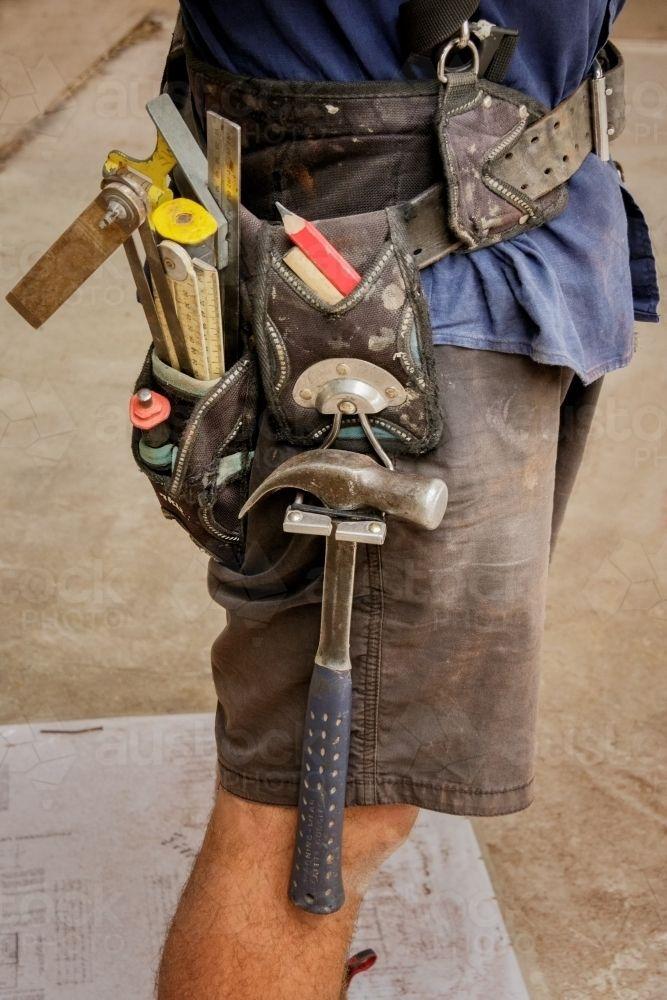 Construction Worker Wearing Work Shirt and Tool Belt