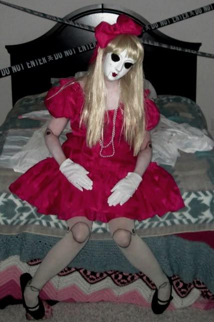two women dressed as creepy doll halloween costumes