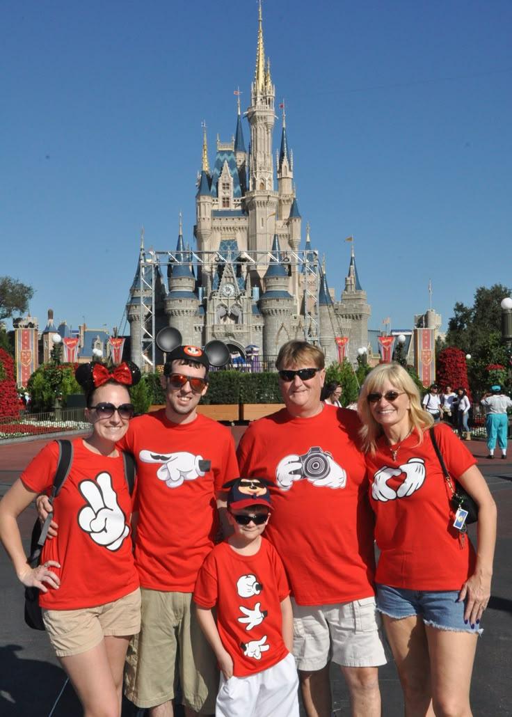 disney world family shirts in front of castle