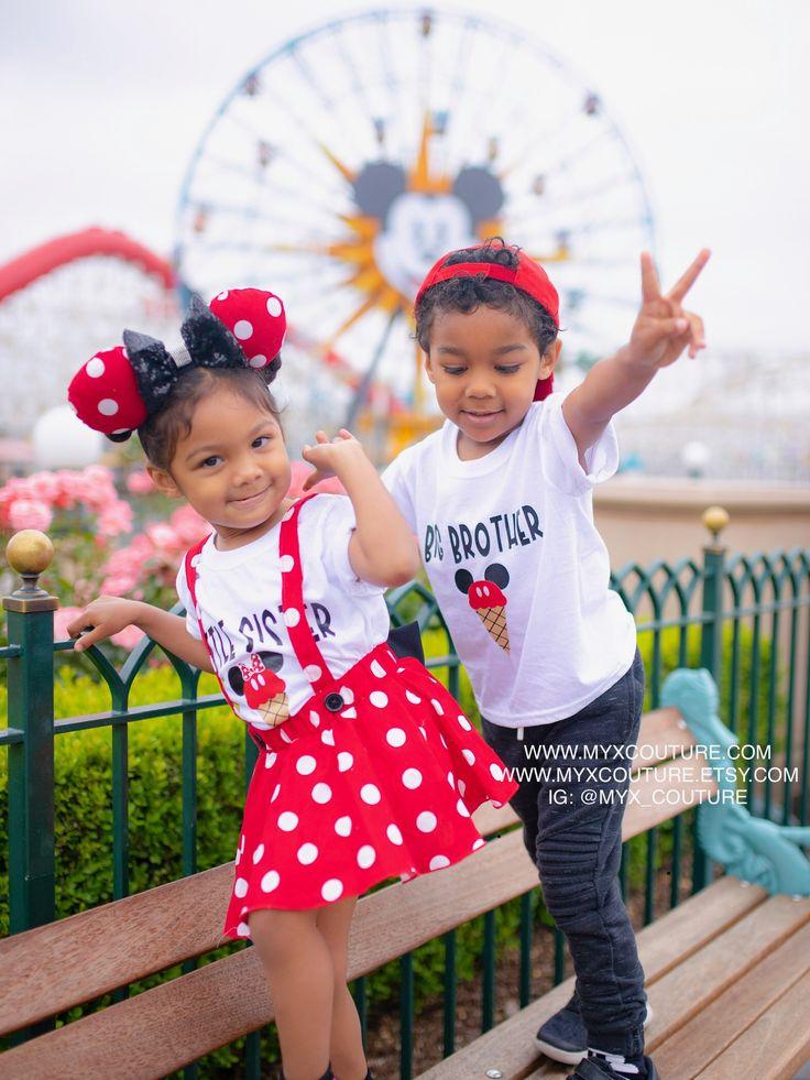 Family dressed in coordinated Minnie Mouse themed outfits for a first birthday