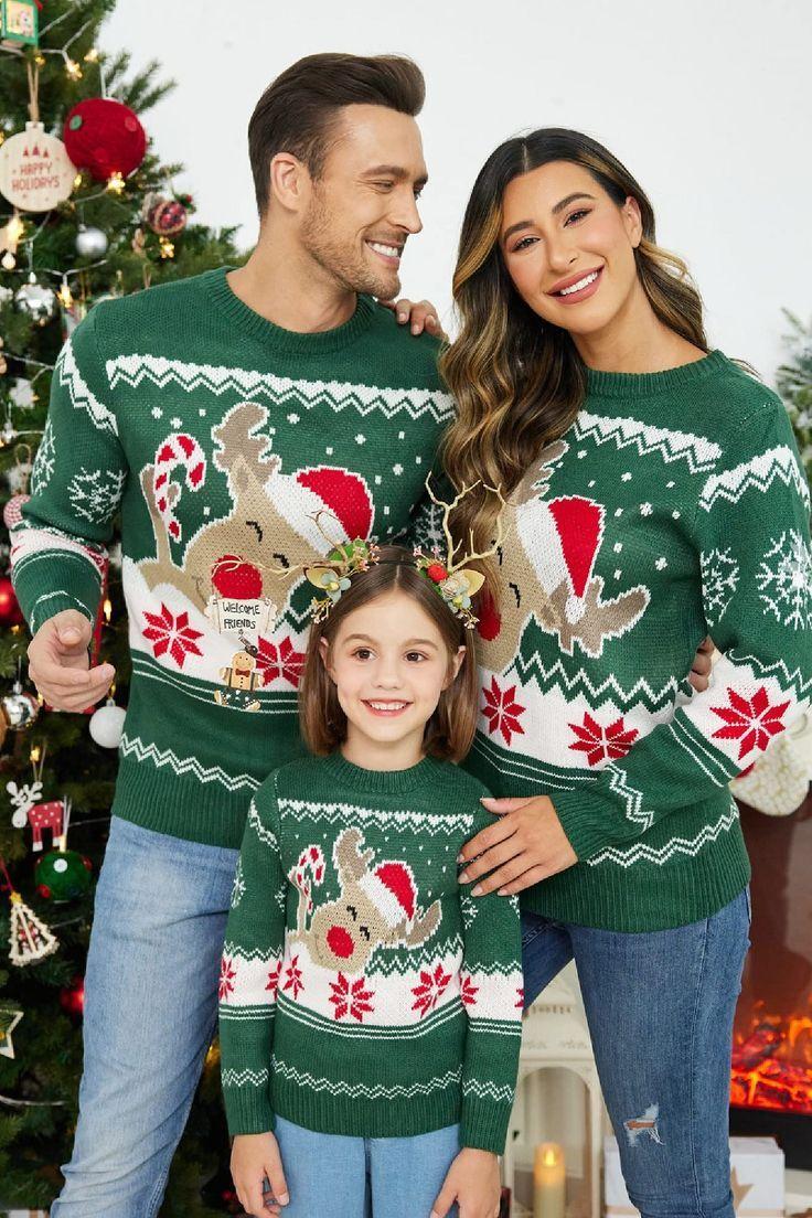 Family Wearing Matching Reindeer Christmas Sweaters