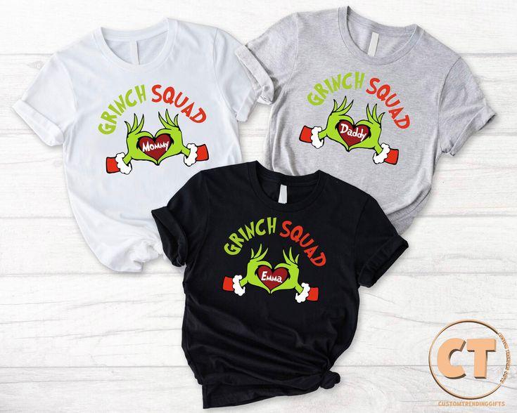 Family Wearing Matching Grinch Christmas Shirts Together