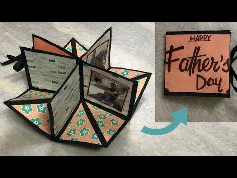 Father and daughter making handmade card for Father's Day
