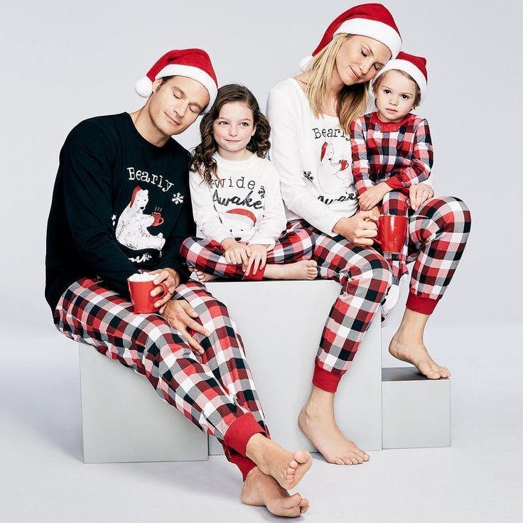 Father and son wearing matching Christmas pajamas