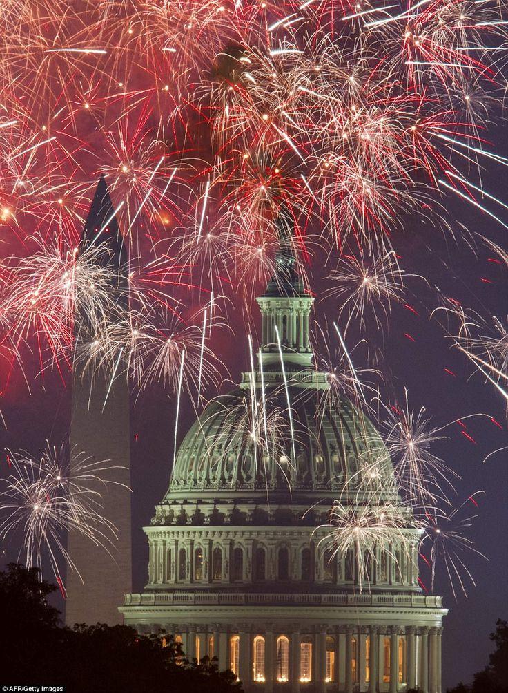 Group of friends wearing patriotic shirts watching fireworks