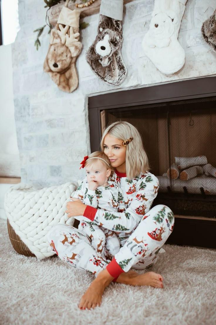 Mommy and Daughter Matching Christmas Pajamas by the fireplace