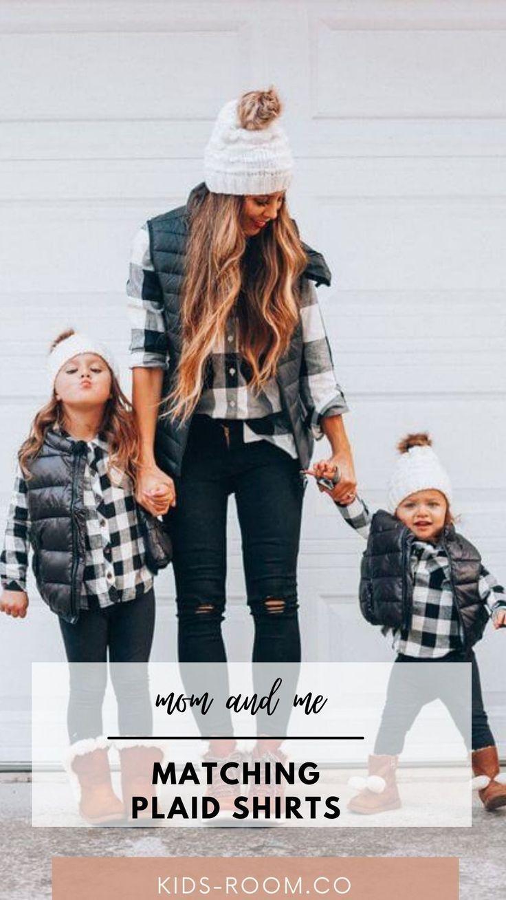 Mother and daughter wearing matching plaid Thanksgiving shirts