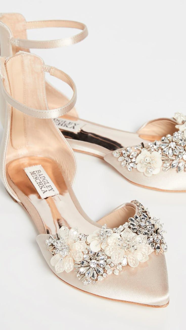 a pair of silver platform shoes on a purple background