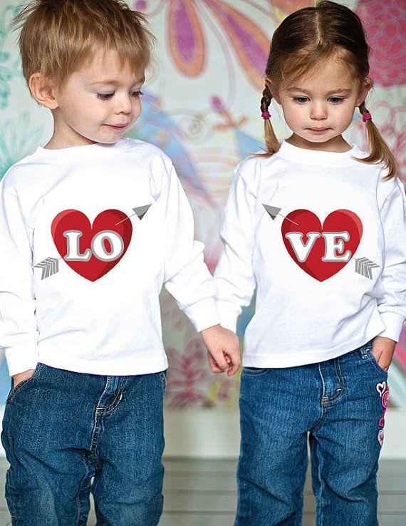 Two siblings wearing matching Valentines Day shirts