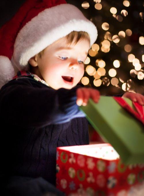 Wife Opening Christmas Present with Joy